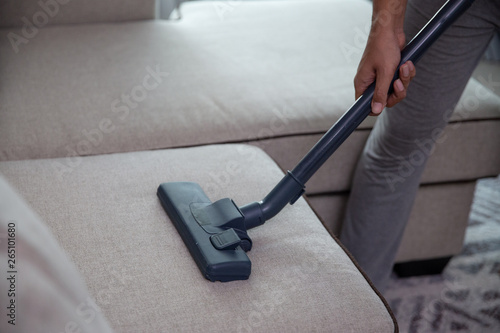 gesture of hand using vacuum cleaner. chore home concept