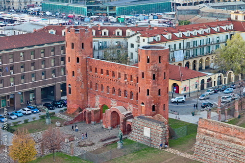 Aerial view from the bell tower of the Cathedral on the Porte Palatine, ancient gateway to the Roman city of Augusta Taurinorum, at sunset, Turin, Piedmont, Italy photo