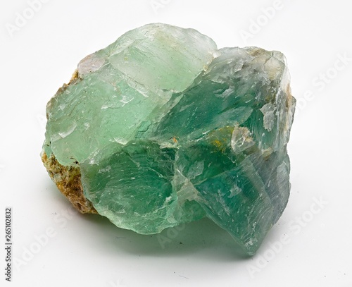Green translucent fluorite mineral crystal stone isolated on white limbo background