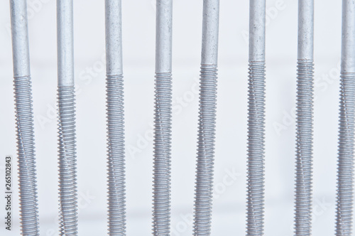 Screws macro photo. Metal screws are used to fasten insulation panels to the metal frame of a new building.