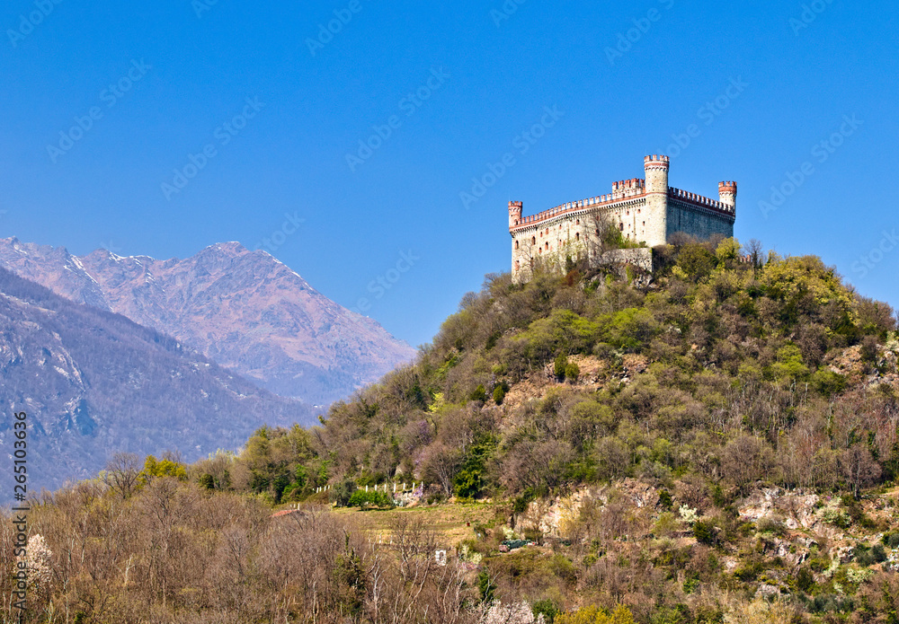 The castle of Montalto Dora, at an altitude of 405 meters, on the Pistono Lake, in the morainic amphitheater of Ivrea, dating back to the mid-12th century.  Clear sunny spring morning