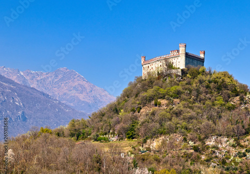 The castle of Montalto Dora, at an altitude of 405 meters, on the Pistono Lake, in the morainic amphitheater of Ivrea, dating back to the mid-12th century. Clear sunny spring morning