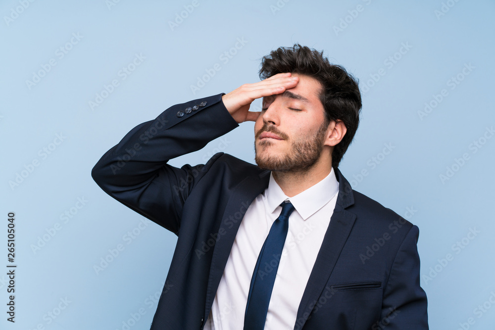 Businessman over isolated blue wall has realized something and intending the solution Businessman over isolated blue wall has realized something and intending the solution