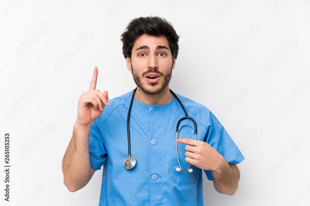 Surgeon doctor man over isolated white wall with surprise facial expression Surgeon doctor man over isolated white wall with surprise facial expression