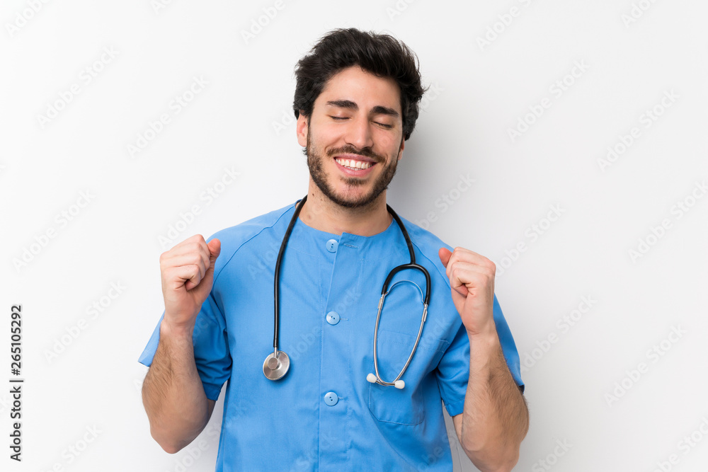 Surgeon doctor man over isolated white wall laughing Surgeon doctor man over isolated white wall laughing
