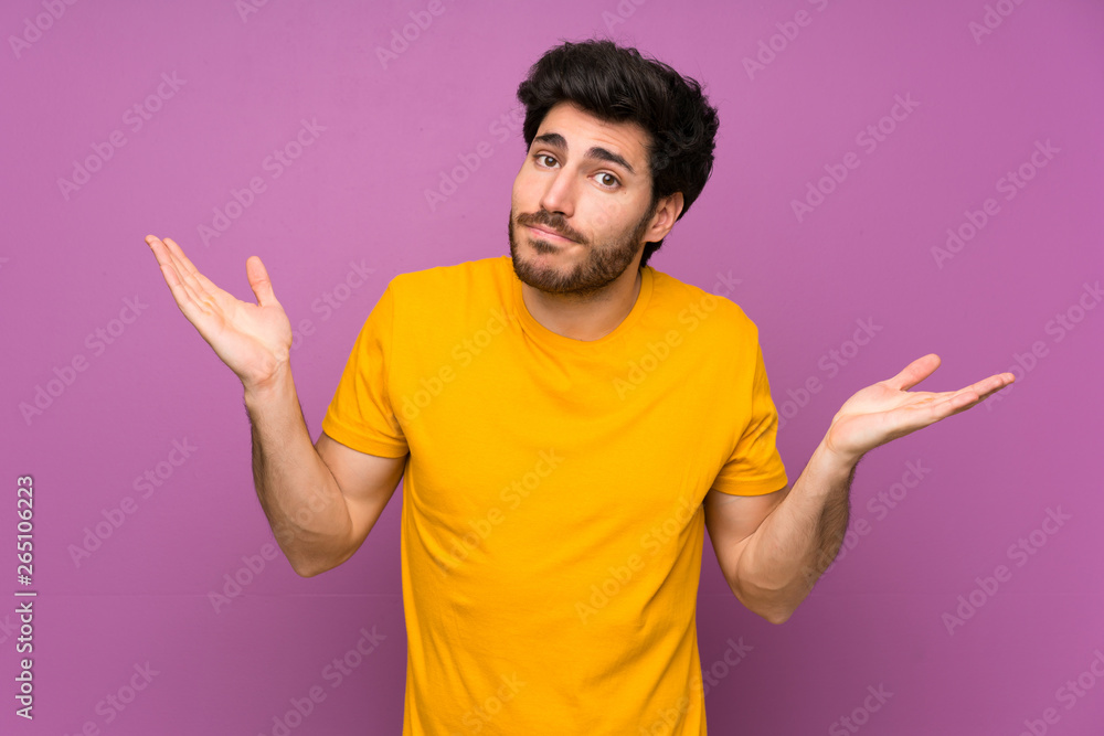 Handsome over isolated purple wall making doubts gesture Handsome over isolated purple wall making doubts gesture