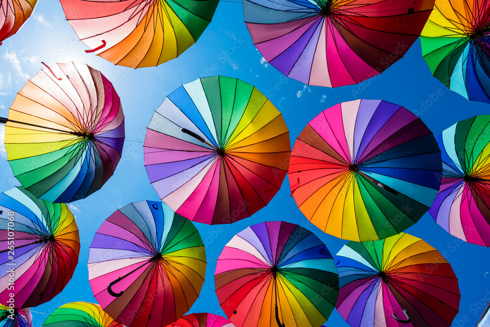 Obraz premium Many colorful umbrellas. Rainbow gay pride protection