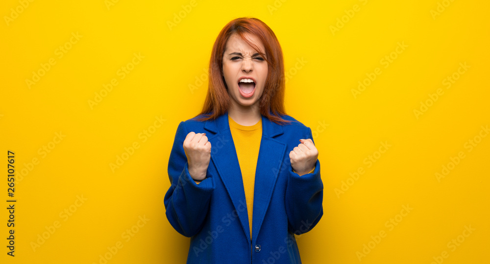 Young redhead woman with trench coat frustrated by a bad situation Young redhead woman with trench coat frustrated by a bad situation