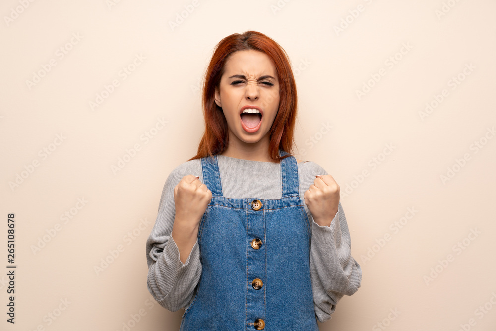 Young redhead woman over isolated background frustrated by a bad situation