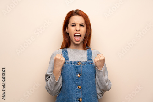 Young redhead woman over isolated background frustrated by a bad situation