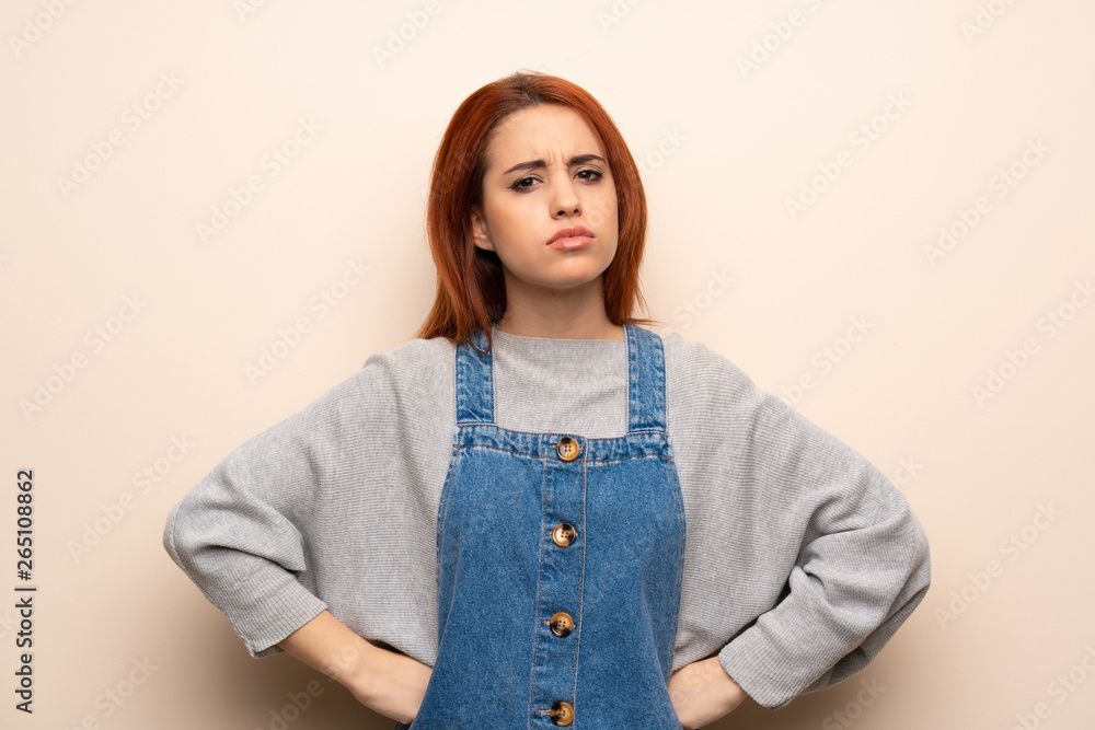 Young redhead woman over isolated background angry Young redhead woman over isolated background angry