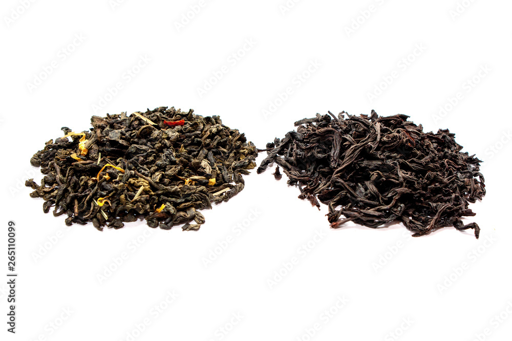 Fototapeta premium Leaves of black and green dry tea isolated on white background. View from above