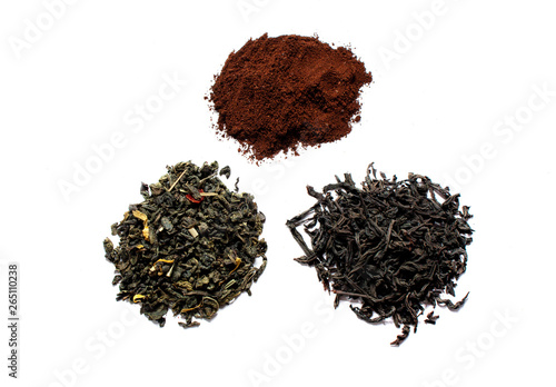 Black and green dry tea leaves and ground coffee isolated on white background. View from above