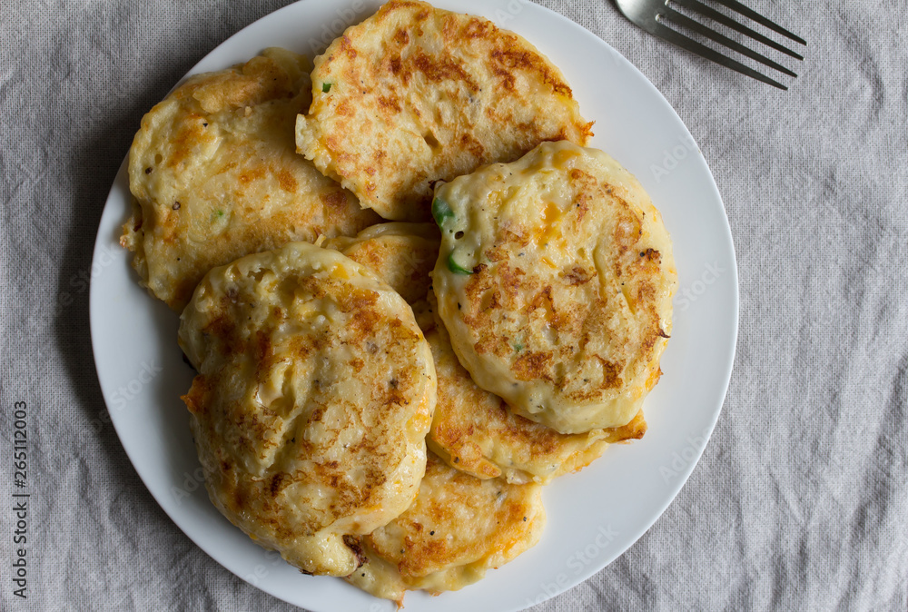 Potato pancakes on white plate - Top view Potato pancakes on white plate - Top view