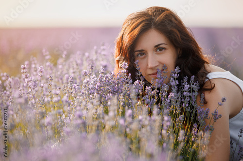 Portrait of a beautiful brunette in a lavender field.