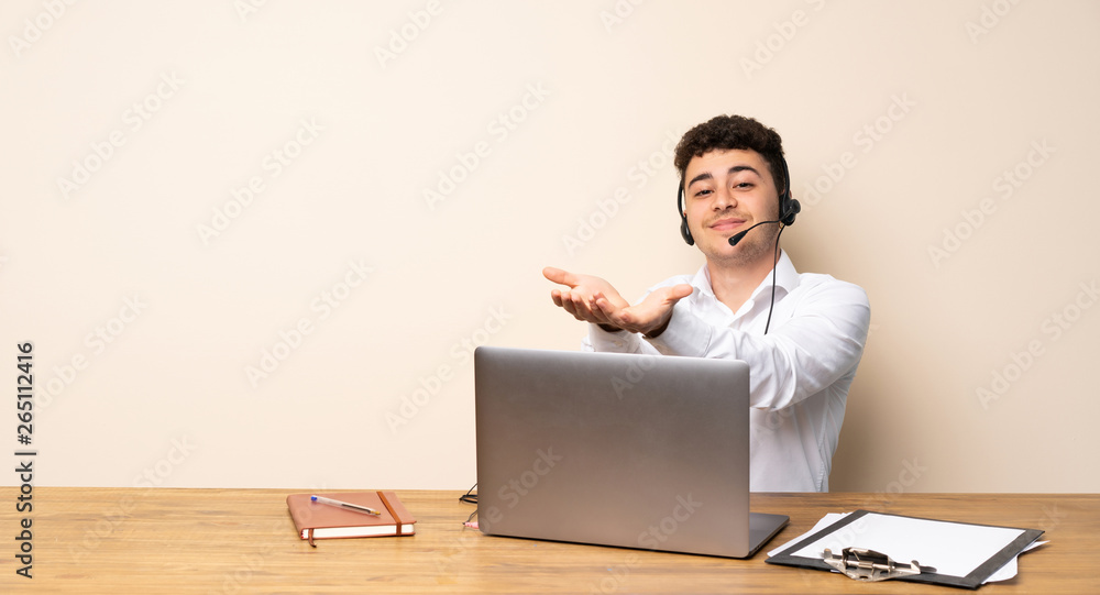 Telemarketer man holding copyspace imaginary on the palm to insert an ad Telemarketer man holding copyspace imaginary on the palm to insert an ad