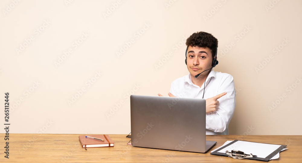 Telemarketer man pointing to the laterals having doubts Telemarketer man pointing to the laterals having doubts