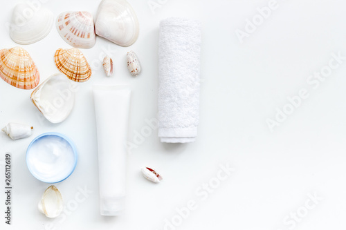 natural cream, lotion with Dead Sea minerals for homemade spa on white table background top view mockup