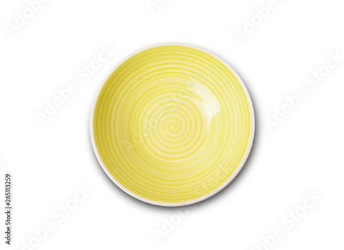 Empty yellow ceramic plate with spiral pattern in watercolor styles