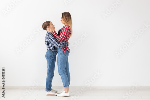 Family, fashion and mother day concept - Mother embrace her son over white background with copy space