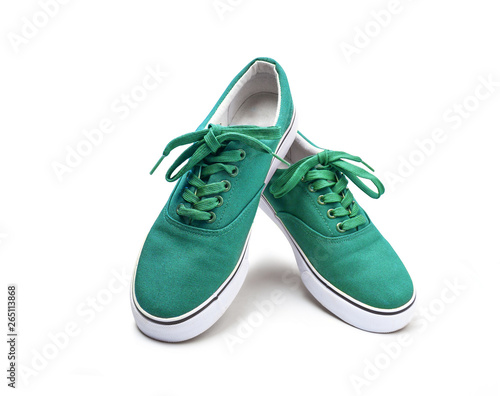 A pair of green canvas shoes isolated on white