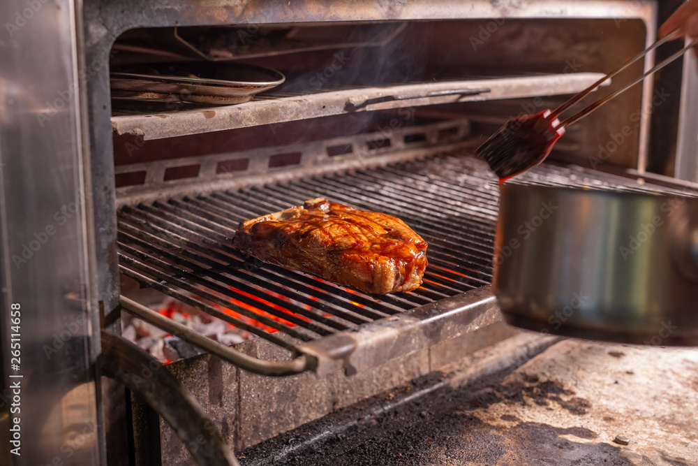 food, craft and delicious concept - cooking steak on a grill food, craft and delicious concept - cooking steak on a grill