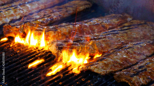 pork baby ribs on a barbecue grill photo