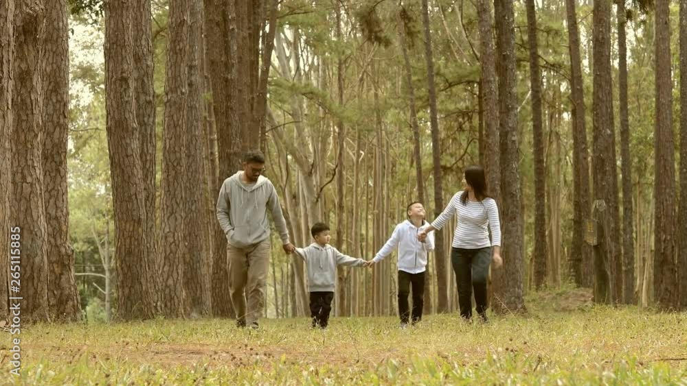 Young family with children having fun in nature in morning sunny day Young family with children having fun in nature in morning sunny day