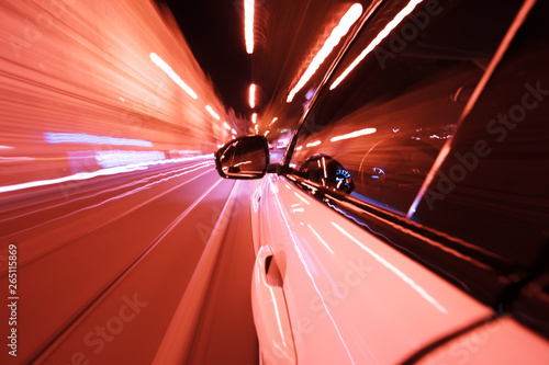 POV of car driving at night city with motion blur