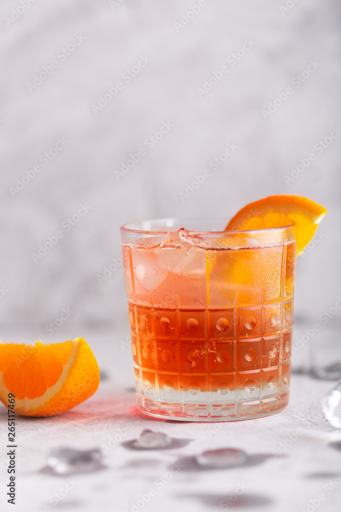 Fresh ice tea summer cocktail with orange and ice Fresh ice tea summer cocktail with orange and ice