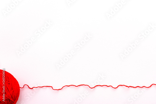 Red yarn on a white background