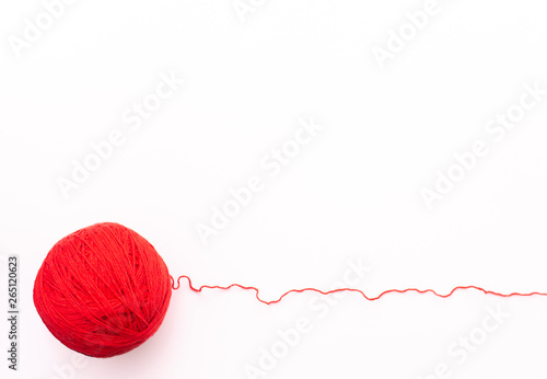 Red yarn on a white background