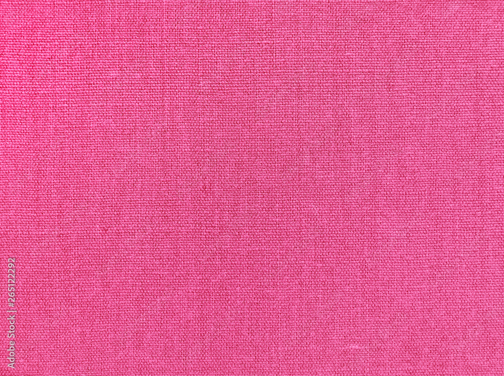 Textured background of pink natural textile Textured background of pink natural textile