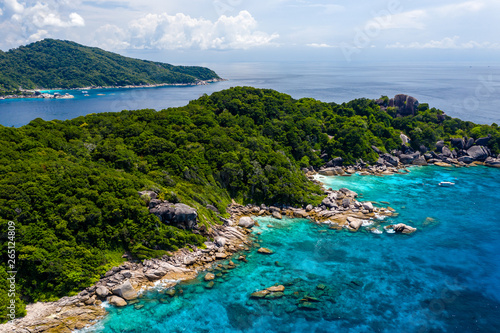 Aerial drone view of boats around the shallow coral reef surrounding beautiful tropical islands (Similan Islands) © whitcomberd