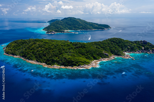 Aerial drone view of paradise tropical islands and coral reef © whitcomberd