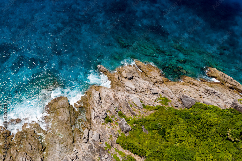 Aerial drone view of beautiful tropical islands with crystal clear waters and lush greenery (Similan Islands, Thailand)