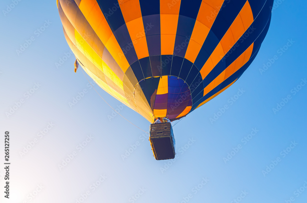 Naklejka premium Colorful hot air balloon flying in the blue sky
