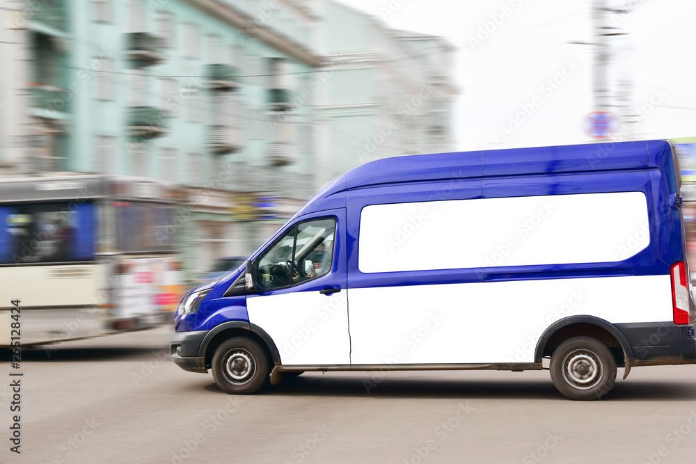 April 13, 2018. Kranoyarsk. Russia. The company's car The Russian Post quickly drives through the city street. Minibus in blue. April 13, 2018. Kranoyarsk. Russia. The company's car The Russian Post quickly drives through the city street. Minibus in blue.
