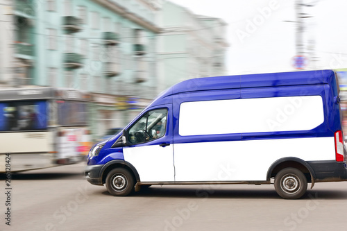 April 13, 2018. Kranoyarsk. Russia. The company's car The Russian Post quickly drives through the city street. Minibus in blue.