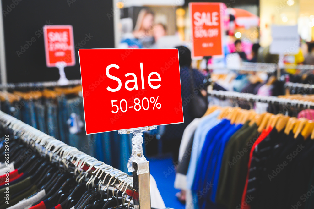 Sale 50-80% off mock up advertise display at clothes line in the shopping department store. Shopping concept. Sale 50-80% off mock up advertise display at clothes line in the shopping department store. Shopping concept.