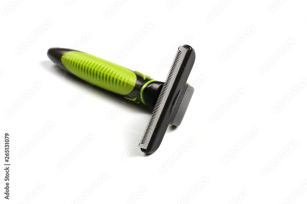 Furminator for combing fur in pets on a white background. Isolate Furminator for combing fur in pets on a white background. Isolate