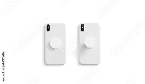Blank white opened and closed phone pop socket mock up on smartphone lying isolated, top view, 3d rendering. Empty popsocket holder for gadget mock up. Clear stand attach grip on the back of mobile.