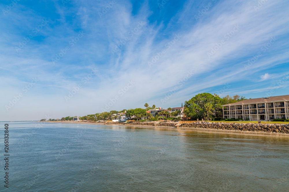 Coastal homes and condos along calm waterfront