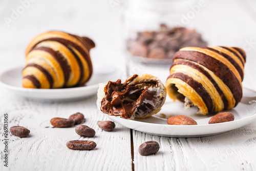 Obraz na płótnie Croissants with chocolate filling cup and fresh morning coffee