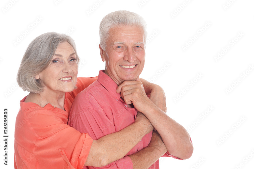 Smiling senior couple wearing bright clothing on white background