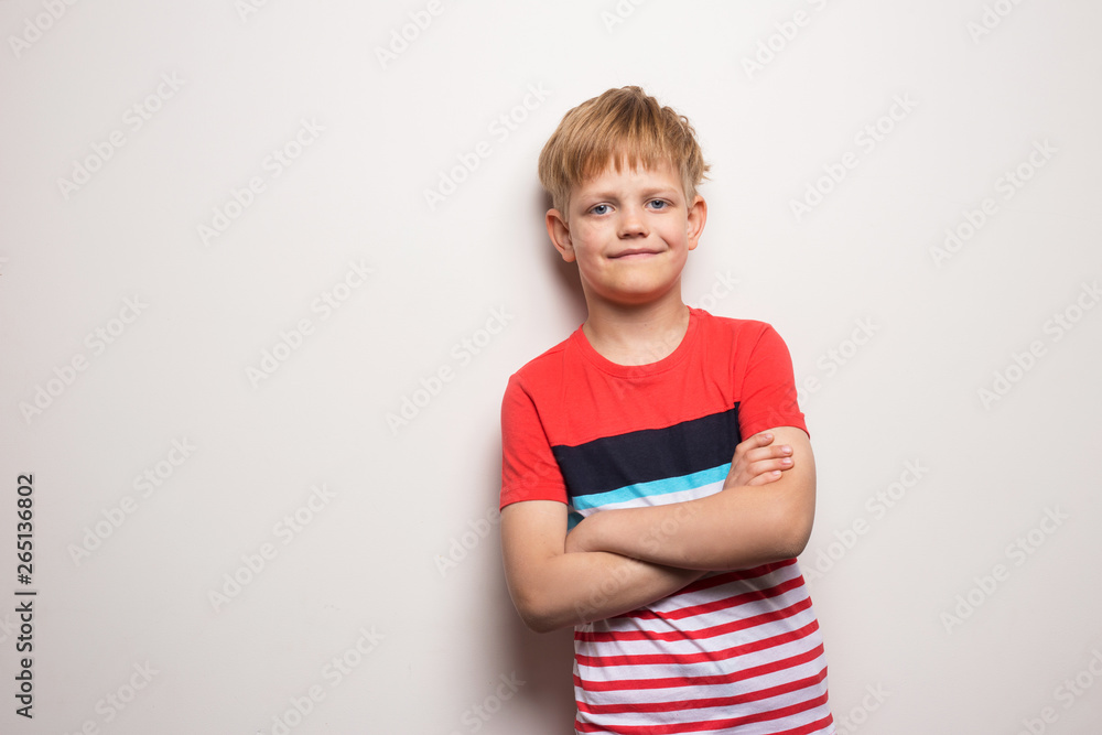 Little smiling boy in t-shirt isolated on white background. Studio portrait Little smiling boy in t-shirt isolated on white background. Studio portrait