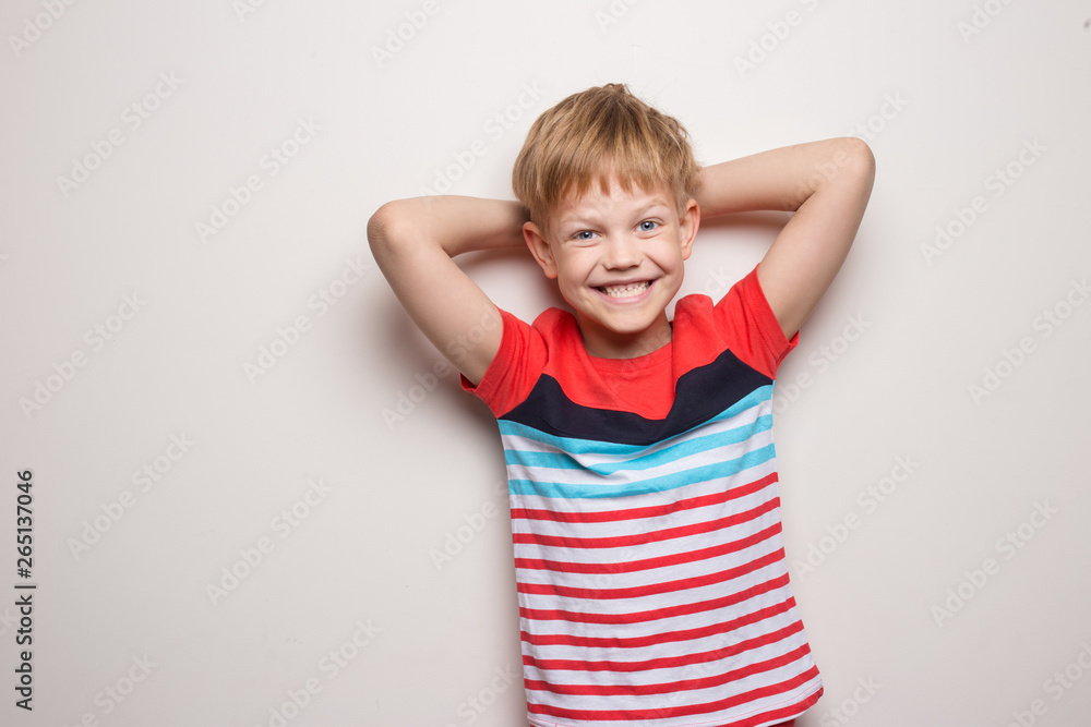 Little smiling boy in t-shirt isolated on white background. Studio portrait Little smiling boy in t-shirt isolated on white background. Studio portrait