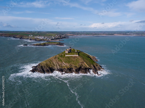 Black lighthouse off the coast of the small irish village called Ballycotton