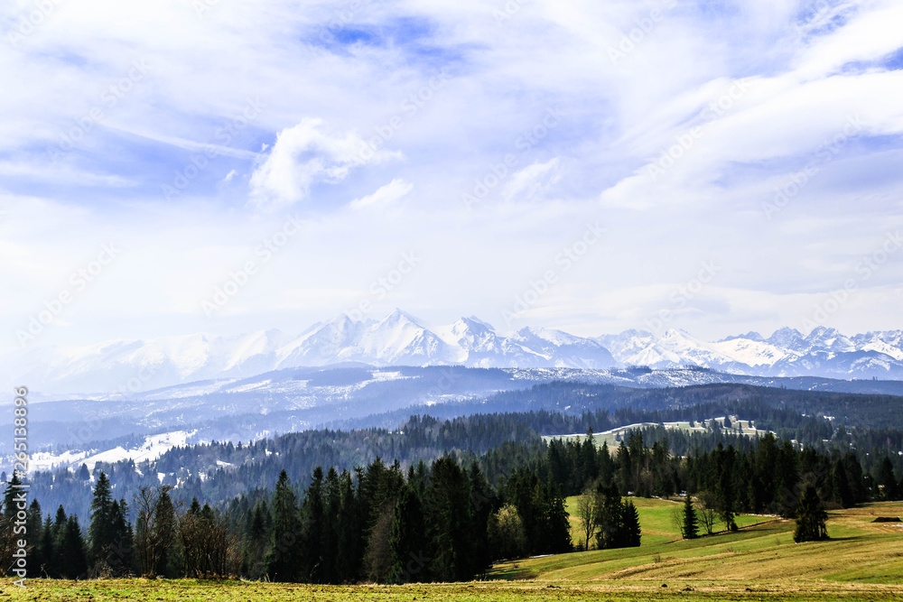 Beautiful landscape of Tatra Mountain covered with snow. View from the green hill. Beautiful landscape of Tatra Mountain covered with snow. View from the green hill.