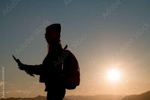 woman silhouette in front of a sunset